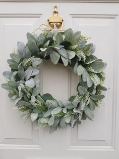 a wreath is hanging on the front door