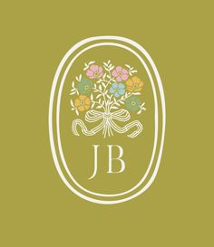 the j b logo with flowers and ribbon on it's front end, in green