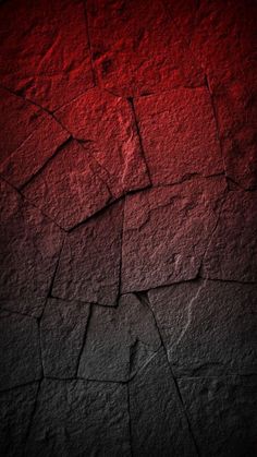 a red and black background with cracks in the concrete, which is very rough to see