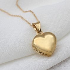 Beautiful 9ct gold opening heart locket necklace. A timeless Christmas gift suitable for all ages Available in two 9ct gold chain lengths 40 and 45cm This simple, classic opening locket makes the perfect gift for all occasions and ages. Easy to wear and beautifully made, this will be a lasting symbol of your love to the lucky recipient. This special 9ct gold locket necklace is available in a choice of chain lengths The perfect gift for birthdays FREE GIFT BOX FREE STANDARD DELIVERY Variations Al Hallmarked Locket Necklace As Valentine's Day Gift, Hallmarked Locket Necklace For Valentine's Day Gift, Valentine's Day Gift Locket Necklace Hallmarked, Valentine's Day Gift Hallmarked Locket Necklace, Mother's Day Yellow Gold Heart Charm Locket Necklace, Gold Hallmarked Locket Necklace For Valentine's Day, Heart-shaped Yellow Gold Locket Necklace For Valentine's Day, Heart-shaped Yellow Gold Locket For Valentine's Day, Yellow Gold Locket Necklace For Valentine's Day