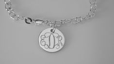 "This lovely sterling silver bracelet features a 17 gauge, high polish sterling silver 1/2\" diameter disc on a sterling silver 7\" chain, with a lobster claw clasp. I can engrave a monogram, one to three initials, or a name, date or word up to 10 characters. The back of the disc can also be engraved with up to 10 characters The bracelet will be delivered to you in a gift box. This style is also available in 8\" Length: https://www.etsy.com/listing/950524673/custom-engraved-monogram-or-initial? Classic Personalized Sterling Silver Charm Bracelet, Personalized Classic Sterling Silver Charm Bracelet, Classic Sterling Silver Personalized Charm Bracelet, Gift Sterling Silver Link Bracelet With Polished Finish, Classic Personalized Name Bracelet, Elegant Personalized Sterling Silver Bracelet, Sterling Silver Link Bracelet With Polished Finish, Polished Sterling Silver Link Bracelet, Polished Finish Sterling Silver Link Bracelet