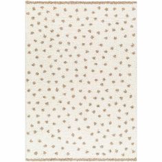 a white rug with brown stars on it