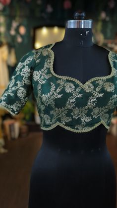 Beautiful and stylish blouse in brocade with floral design.  This blouse can be done with or without the bust cup inserts . The blouse is fully lined is cotton. Elegant Green Top For Reception, Green Blouse With Floral Embroidery For Reception, Green Floral Embroidered Blouse For Reception, Saree Blouse With Lace Work For Reception, Brocade Blouse Piece With Cutdana For Reception, Reception Brocade Blouse Piece With Cutdana, Elegant Cotton Silk Tops For Festivals, Bollywood Brocade Blouse With Cutdana, Designer Brocade Blouse Piece With Cutdana