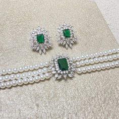 Emerald choker features beautiful big emerald cut green gemstone with pearls and CZ diamonds in it. Handmade with elegance, it's a perfect blend of sophistication and style. Ideal for weddings or as a bridesmaid gift, this necklace makes a thoughtful and beautiful present for your sister, adding a touch of luxury to any occasion. *𝐏𝐑𝐎𝐃𝐔𝐂𝐓 𝐃𝐄𝐓𝐀𝐈𝐋* * 𝐌𝐚𝐭𝐞𝐫𝐢𝐚𝐥: Brass * 𝐏𝐥𝐚𝐭𝐢𝐧𝐠: White Rhodium Plated * 𝐒𝐭𝐨𝐧𝐞: AAA-quality CZ Diamond & Emerald. *𝐃𝐈𝐌𝐄𝐍𝐒𝐈𝐎𝐍𝐒* *? Elegant Emerald Bridal Necklace For Formal Occasions, Elegant Formal Bridal Necklace With Emerald, Formal Green Pearl Necklaces, Elegant Green Bridal Necklace For Formal Occasions, Elegant Formal Emerald Bridal Necklace, Elegant Green Bridal Necklace With Sparkling Stones, Elegant Emerald Bridal Necklace, Luxury Emerald Cut Necklace For Wedding, Luxury Emerald Cut Emerald Necklace For Wedding