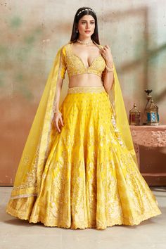 Shop yellow embroidered Banarasi silk lehenga online in USA with dupatta. Look your best on festive occasions in latest designer saris, pure silk sarees, Kanjivaram silk sarees, handwoven saris, tussar silk sarees, embroidered saris from Pure Elegance Indian clothing store in USA.-full view Yellow Raw Silk Choli With Intricate Embroidery, Yellow Embroidered Raw Silk Sharara, Embroidered Yellow Raw Silk Sharara, Yellow Raw Silk Lehenga With Cutdana, Yellow Embroidered Banarasi Silk Choli, Yellow Cutdana Raw Silk Lehenga, Yellow Dola Silk Anarkali Set With Intricate Embroidery, Yellow Anarkali Set With Intricate Embroidery In Dola Silk, Yellow Traditional Wear With Meenakari For Wedding