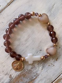 Such a beautiful decade rosary bracelet with rose gold and sparkling crystal! Gold filled Virgin Mary Medal and mother of pearl cross Rosary Bracelet Diy, Leather Jewelry Bracelet, Rosary Jewelry, Decade Rosary, Prayer Bracelet, Catholic Jewelry, Rosary Bracelet, Beads Bracelet Design, Christian Jewelry