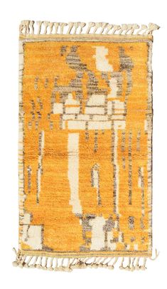 an old rug with yellow and grey colors