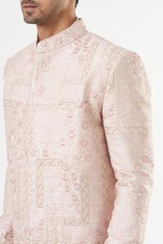 Blush pink sherwani in silk base with floral embroidery. Comes with a pant. - Aza Fashions Formal Pink Kurta With Naqshi Detailing, Pink Long Sleeve Sherwani With Dabka Work, Pink Bandhgala With Dabka Work, Pink Fitted Nehru Jacket, Pink Sherwani With Dabka Work For Eid, Pink Traditional Naqshi Sherwani, Pink Dabka Work Sherwani For Eid, Pink Nehru Jacket With Resham Embroidery, Designer Pink Kurta With Resham Embroidery