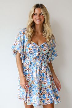 Elevate any look with a darling piece like the Poised Sensibility Blue Floral Mini Dress! Perfect for a variety of occasions, this dress offers both style and comfort in a beautifully designed package. The dress features a captivating blue background adorned with delicate floral prints, creating a fresh and feminine look. The puff sleeves add a touch of whimsy and romance, enhancing the dress's overall playful and elegant appeal. Whether you're heading to a casual brunch, a summer garden party, Feminine Blue V-neck Dress, Blue Summer Mini Dress For Garden Party, Summer Mini Dress For Garden Party In Blue, Blue Floral Print Mini Dress For Day Out, Light Blue Floral Mini Dress For Day Out, Blue Floral Print Mini Dress For Brunch, Light Blue Summer Mini Dress For Garden Party, Blue Knee-length Mini Dress For Garden Party, Light Blue Floral Print Mini Dress For Casual Wear