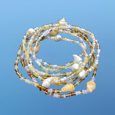 Boho Hippie 2x White / Ivory / Brown / Pearl  Beads with Trumpet Shell Shells Seashells Waist Bead    Custom made  Body Jewellery  Silver  screw clasp Made to fit - Leave message for individual chain sizes  Waist line / Upper hip line / hip line  Check out more of my waist Beads collection 🤍 https://etsy.me/3JbHvCJ Summer Beach Gold Beaded Bracelets, Summer Gold Beaded Bracelets For Beach, Gold Beaded Bracelets For Summer Beach, White Shell Beaded Bracelets For Summer, Summer White Shell Beaded Bracelets, Gold Strand Beaded Bracelets For Summer, Bohemian Waist Beads For Summer Beach, Bohemian Waist Beads For Beach In Summer, Bohemian Summer Festival Waist Beads