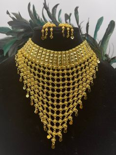 We bring beautiful Jewelry sure to elevate any look! Kindly pay attention to all photos and video and ask questions about the item prior to ordering. Traditional Gold Jewelry For Party, Elegant Jewelry For Navratri Party, Gold Chandbali Jewelry Sets For Parties, Traditional Gold Anarkali Set For Eid, Traditional Jewelry With Latkans For Party, Traditional Latkans Jewelry For Parties, Bollywood Bridal Necklace With Intricate Design For Festivals, Gold Dabka Anarkali Set For Navratri, Gold Anarkali Set With Dabka For Festivals