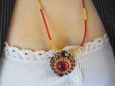 "This beautiful Clear Red Vintage Rhinestone Earring came straight from Grandma's jewelry box. Valentine Mother's Day Christmas Holiday New Years. Great with a little black or red dress for a night on the town. Opera?  It has a round red glass cabachon center set in gold toned metal surrounded by 26 small square cut sparkly red Rhinestones and 2 round red glass faceted stones. The focal component measures 1 1/4\" in length. There are minor chips on the bottom round faceted stone which is not noticeable. It is strung on gold colored 49 strand wire for strength and flexibility along with gold colored Toho seed beads and tiny red glass seed beads. . The necklace measures 23 1/2' in length and is finished with a small gold colored toggle clasp. One bracelet has a round red glass bead centered Traditional Jewelry For Valentine's Day Celebration, Valentine's Day Beaded Jewelry Gift, Handmade Jewelry For Valentine's Day Party, Vintage Handmade Jewelry For Valentine's Day, Handmade Round Jewelry For Valentine's Day, Handmade Jewelry For Valentine's Day Formal Occasion, Handmade Jewelry For Valentine's Day Formal, Handmade Jewelry For Formal Valentine's Day, Handmade Jewelry For Wedding And Valentine's Day