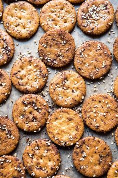 baked cookies with sesame seeds and sea salt on a baking sheet, ready to be eaten