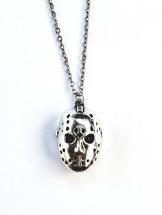 "Jason Voorhees Necklace This necklace is made with a 18\" hypoallergenic 1mm thick stainless steel chain and a silver plated lead free zinc alloy decorative charm. * Please note this listing is for one necklace. All other items pictured are not included." Horror Movies Halloween, Witch Pentagram, Camp Crystal Lake, Jason Voorhees, Crystal Lake, Kitchen Witch, Gas Mask, Friday The 13th, Steel Chain