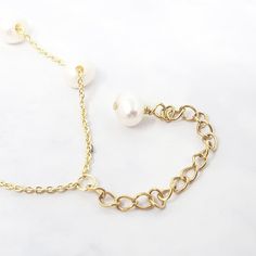 Our Freshwater Pearl Double Chain Wedding Bracelet, crafted with 18ct gold-plated copper and adorned with freshwater pearls, is the perfect elegant gift for brides, bridesmaids, or any special occasion.  Elevate your bridal ensemble with our Freshwater Pearl Double Chain Wedding Bracelet, an exquisite accessory perfect for bridesmaids or brides on their special day.   This jewellery arrives beautifully packaged and ready to gift. It would make a really thoughtful and meaningful birthday gift, Ch Wedding Baroque Pearl Chain Bracelet, Elegant Gold Bracelet With Baroque Pearl, Delicate Baroque Pearl Bracelet With Pearl Chain, Delicate Baroque Pearl Chain Bracelet, Delicate Baroque Pearl Bracelet, Adjustable Pearl Bracelet With Pearl Pendant For Wedding, Gold Pearl Bracelet With Pearl Charm For Formal Occasions, Gold Pearl Oyster Bracelet For Formal Occasions, Luxury Gold Bracelet With Pearls