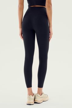 A sleek, form fitting high waist legging engineered to fit every curve and flow with your workouts. Our ultra luxe Airweight fabric has a supremely soft hand and second skin comfort. BEST FOR: hot yoga, barre, Pilates. Model is 5'10" and wears a size small. Model Stats:Height: 5’10”, Bust: 32", Waist: 23”, Hips: 34”Wearing size: Small Black Leggings For Pilates, Sleek Stretch Workout Pants, Sleek Solid Color Tights For Workout, Sleek Tight Bottoms For Pilates, Athleisure Yoga Leggings With Light Support, Athleisure Leggings For Yoga With Light Support, Sportswear Yoga Pants With Wide Waistband, Black Elastane Leggings For Pilates, Light Support Athleisure Leggings For Yoga