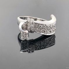 Weight:13.1gr Metal:18kt white gold and platinum Stones:Diamonds *Cut:Old mine *Carat weight:1.60ct approximately *Colour:H/I *Clarity:VS/Si Condition:Very Good Hallmarks: French, eagle and dog's heads Comments: This Art Deco ribbon ring, from the 1930s, is set with old mine cut diamonds. There is an approximate total carat weight of 1.60ct. The ring is made in 18kt white gold and platinum since it is marked with the French eagle and dog's heads. It is in very good vintage condition. Ring Size:5 Diamond Ribbon, Ribbon Ring, Kids Rings, Special Ring, Art Deco Diamond, Yellow Gold Pendants, Diamond Fashion, Brilliant Cut Diamond, Band Ring