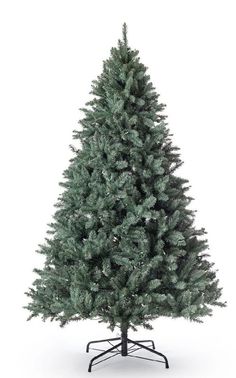 a small christmas tree on a stand against a white background