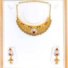 Experience sheer elegance with our Exclusive Enameled Kundan Choker Set, boasting exquisite Kundan stones and crafted with 22k antique gold weighing 63.7 grams. This opulent set features an adjustable length of 14" with 1" links and a secure hook lock. The stunning choker has a width of 1.75" and a drop length of 0.75". It also includes matching earrings, 2.3" in length with screw backs. Make a bold statement with this unique and timeless piece, finished with a regal antique gold shine. PRODUCT Ceremonial 22k Gold Meenakari Jewelry, Yellow Gold Round Temple Necklace With Meenakari, 22k Gold Temple Necklace With Meenakari, 22k Yellow Gold Kundan Necklace With Meenakari, 22k Gold Round Temple Necklace With Meenakari, Ceremonial Gold Kundan Necklace Hand Set, Kundan Filigree Yellow Gold Jewelry, Yellow Gold Kundan Filigree Jewelry, Gold Round Temple Necklace With Meenakari