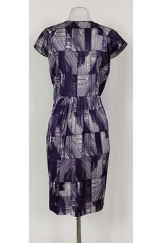 This pretty dress has a fun abstract print in a chic purple and white color. Cap sleeves, a plunging neckline and pleats along the waist all elevate this basic dress from Poleci. It can be dressed up or down for any occasion. Size 4 91% silk, 9% lycra V-neck Cap sleeves Side zipper Unlined Abstract print Bust 34.5" Waist 30" Shoulder to hem 39" Purple Lined Midi Length Dresses, Purple Fitted Dress With Pleated Bodice, Elegant Blue Dress With Abstract Print, Fitted Purple Printed Dress, Elegant Sheath Printed Dresses, Elegant Printed Sheath Dress, Elegant Fitted Pleated Dress With Floral Print, Fitted Purple Printed Midi Dress, Chic A-line Dress With Abstract Print