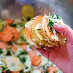 a person holding up some food in their hand