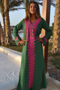 A stunning embroidered Kaftan dress that is elegant, colorful, and unique! The dress is made of Egyptian cotton that has a soft feel to it so you will surely feel comfortable and royal in it. It also comes with a small invisible pocket on the right side of the Kaftan for added practicality. You can wear this Kaftan practically anywhere and for any occasion. You can dress it up with a pair of heels and strut like an Egyptian queen in any gathering, resort, or party. Or you can dress it down with Traditional Green V-neck Tunic, Green Tunic Kaftan For Festivals, Traditional Green V-neck Dress, Multicolor Embroidered Kaftan With Dabka Work, Green Kurta With Embroidered Neckline For Eid, Green Kaftan With Resham Embroidery For Festivals, Green Dress With Embroidered Neckline, Green Long Sleeve Dress With Embroidered Neckline, Green Maxi-length Kaftan For Festivals