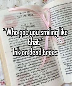 an open book with the words who got you smiling like that ink on dead trees