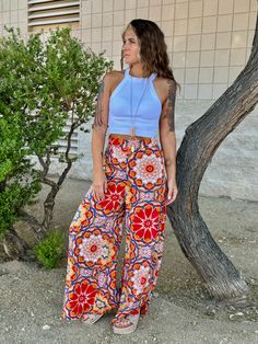 Wide leg Boho print pants. Lightweight and flowy. Color/Prints: Orange Mandala or Teal Paisley Run TTS Small - size 4 - 27” waist Medium - size 6 - 28” waist Large - size 8/10 - 31” waist Casual Boho Print Bottoms For Beach, Bohemian Printed Bottoms For Summer, Bohemian Printed Summer Bottoms, Bohemian Floral Print Beach Bottoms, Bohemian Floral Beach Bottoms, Summer Wide Leg Floral Print Pants, Summer Wide Leg Pants With Floral Print, Summer Floral Print Wide-leg Pants, Printed Wide Leg Summer Pants