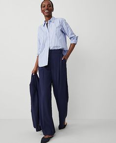 A modern must-have with a statement leg and flattering high waist. Belt loops. Front pleats. Front off-seam pockets. Back besom pockets.,Leg Shape:Leg Shape: Wide Leg – a modern must-have with a statement leg and flattering high waist,Rise:High rise: sits 1/2" to 1" below natural waist,Imported:Imported,Fit:Fit: Tailored & fitted,Length:Full length: 32" inseam with 26 1/2" leg opening,Fabrication:73% Polyester, 24% Rayon, 3% Spandex,Garment Care:Machine Washable The High Rise Pleated Wide Leg Pa Modern Bottoms With Pockets For Daywear, Modern Daywear Bottoms With Pockets, Tailored Bottoms With Pockets For Daywear, Pleated Full-length Wide Leg Work Pants, Chic Navy Wide-leg Pants, Navy Fitted Wide-leg Dress Pants, Navy Wide-leg Bottoms With Pockets, Navy Relaxed Fit Wide-leg Pants, Latest Fashion Trends For Women