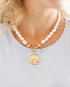 Our Marbella Pearl Necklace is the epitome of classy and timeless style. Connected to the pendant by our signature Bentley Beads, freshwater pearls give this piece an heirloom feel. Wear it as an accessory to your beachside ensemble with our Marbella Studs or as the perfect piece to complement your happy hour mini dress. Elegant Pearl White Jewelry For Beach, Elegant Shell-shaped Pearl Drop Necklace, Elegant Beach Pearl Necklace With Pendant, Pearl Shell Charm Jewelry, Beach Pearl Drop Necklaces, Pearl White Shell-shaped Necklace With Pearl Pendant, Pearl White Shell Pearl Necklace With Pendant, Elegant Pearl Charm Necklace For Beach, Beach Baroque Pearl Jewelry With Pearl Charm