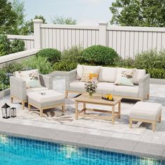 the patio furniture is by the swimming pool