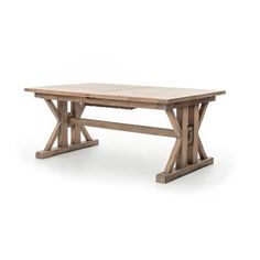 a wooden table sitting on top of a white floor