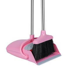 two pink brooms with black bristles on them