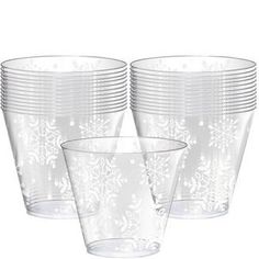 frosted glass cups with white snowflakes on the rims are lined up