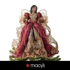 a christmas ornament with a woman in a red dress