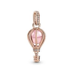 Reach new heights with the Sparkling Pink Hot Air Balloon Dangle Charm. This warm-toned charm is hand-finished in 14K rose gold-plating. Beaded ropes encase a fairy tale pink crystal accented by shimmering clear cubic zirconia. The bail and base of the balloon are embellished with glittering pavé. Below, a small gondola awaits to transport you to your destination. Wear it for daily inspiration or gift it to someone who is ready for their next adventure. Pink Hot Air Balloon, Pandora Rose Gold, Pandora Rose, Charms Pandora, Rose Gold Charms, Bracelet Pandora, Pandora Bracelet Charms, Rose Gold Pink, Pandora Charm