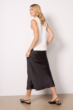 Crafted in sleek satin fabric, the Maddie skirt by EVEREVE is a chic day-to-night staple, featuring a midi silhouette with a hidden elastic waistband. You'll love it paired with everything from a sweater and flats to a fitted tank and heels. | EVEREVE Women's Maddie Satin Skirt, Size XL, Black Chic Satin Maxi Skirt For Work, Chic Stretch Satin Skirt, Summer Silk Maxi Skirt For Work, Silk Maxi Skirt For Summer Workwear, Chic Silk Skirt For Daywear, Chic Midi Length Viscose Skirt, Black Viscose Skirt For Spring, Sleek Spring Midi-length Bottoms, Brand Style Guide