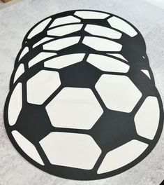 a black and white soccer ball on a table