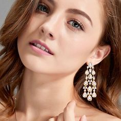 Add a touch of luxury to your wedding day with this unique pair of earrings! The flawlessly faceted cubic zirconia stones capture the light in a dazzling array of sparkles, while the delicate links add fluidity and motion. The earrings are rhodium / gold plated for a bright finish which enhances the intricate detailing and conveys a modern take on old elegance. Length: 2.75" (approx. 7cm). Width: 0.86" (approx. 2.2cm). Weight: 12g. Available in Silver and Yellow Gold finishes. To make your choic Bridesmaid Pearl Earrings, Wedding Bride Jewelry, Gold Earrings Wedding, Crystal Bridal Earrings, Silver Wedding Jewelry, Pearl Earrings Wedding, Gold Bridal Earrings, Pearl Jewelry Wedding, Bridal Earrings Pearl