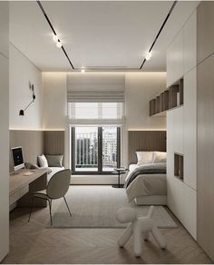 a bedroom with a bed, desk and chair in it