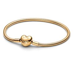 Make your story shine with the Pandora Moments Heart Clasp Snake Chain Bracelet. Our iconic snake chain bracelet gets a gleaming update in 14k gold plating, with a polished heart-shaped clasp. The clasp includes an engraved Pandora logo on one side and the Pandora Crown O logo on the other. Style this Pandora snake chain bracelet with up to 16 to 18 charms for an iconic everyday look that is all yours. Pandora Style #: 563050C00-20 Pandora Gold Jewelry, Pandora Gold Bracelet, Gold Pandora Bracelet, Gold Pandora, Sugar Mama, Pandora Logo, Expensive Things, Pandora Gold, Wedding Day Jewelry