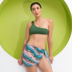 Explore our Sarong - A Beachwear Essential! This stylish and versatile sarong features unique, nature-inspired designs. Whether you're at the beach, by the pool, or out and about, it's perfect. You can wear it as a scarf, shawl, wrap, or even transform it into a skirt or dress. One size fits all. Keep cool in hot weather while staying chic and coordinated with your swimsuit. A great gift idea! Details Stunning painted designs inspired by nature and traditional motifs. Versatile - wear it as a co Green Printed Tankini For Beachwear, Green Printed Tankini For Poolside, Trendy Green Swimwear For Vacation, Casual Swim Skirt For Beach Vacation, Green Printed Tankini For Vacation, Printed Green Tankini For Vacation, Summer Printed Sarong For Poolside, Beachy Sarong For Vacation Sunbathing, Casual Multicolor Sarong For Beach Season