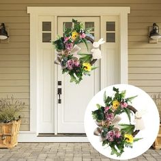 two wreaths on the front door of a house with flowers and leaves hanging from them