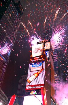 fireworks and confetti are lit up in the city