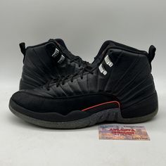 This Air Jordan 12 Utility Grind Black (DC1062-006) is the perfect addition to any sneaker collection. The shoe features a black colorway with a leather upper material, making it durable and stylish. The model is a Men's size 11.5 and is a part of the Air Jordan product line. The sneaker has a unique Style Code (DC1062006) and was released in 2021. It is perfect for athletic activities and is categorized under Men's Shoes and Athletic Shoes. The shoe brand is Jordan and is perfect for sneakerheads looking to add a new pair to their collection. No box Jordan Mid-top Fade-resistant Streetwear Shoes, Streetwear Jordan Shoes With Lace-up Design, Jordan Lace-up Shoes With Boost Midsole For Streetwear, Dynamic Jordan Shoes For Streetwear, Leather Lace-up Basketball Shoes For Streetwear, Jordan Mid-top Shoes With Rubber Sole For Streetwear, Mid-top Jordan Shoes With Rubber Sole For Streetwear, Leather Jordan Shoes For Streetwear, Leather Jordan Lace-up Shoes For Streetwear