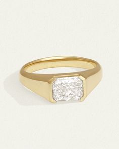 A unisex seal ring in solid gold with 1.5ct radiant cut lab diamond. Shop this contemporary signet ring with minimalist lines & a polished finish. Modern Signet Ring With Rectangular Stone And Polished Finish, Modern Signet Ring With Rectangular Stone For Formal Occasions, Modern Baguette Cut Rings For Everyday Luxury, Modern Square Cut Signet Ring With Polished Finish, Modern Square Cut Signet Ring For Formal Occasions, Timeless Signet Ring With Single Diamond, Modern Diamond Signet Ring With Tension Setting, Classic Square Cut Signet Ring For Anniversary, Modern Formal Signet Ring With Single Diamond