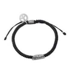 From Thailand's Napapat comes this cord bracelet in an onyx hue. The work of Karen hill tribe artisans the bracelet is expertly braided by hand. It features a cylindrical hand-stamped silver accent with a flower motif and a silver peace symbol charm which both contrast nicely against the dark tone of the bracelet. A sliding knot closure allows for an individualized fit. Adjustable Artisan Sterling Silver Beaded Bracelets, Handmade Black Sterling Silver Braided Bracelet, Artisan Hand Wrapped Black Bracelets, Artisan Hand Wrapped Black Bracelet, Silver Beaded Bracelets With Adjustable Cord, Black Sterling Silver Braided Bracelet Gift, Casual Silver Hand Wrapped Beaded Bracelets, Everyday Silver Braided Bracelet With Sliding Knot, Artisan Hand-wrapped Black Bracelet