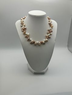 If you're in search of a timeless necklace, your search ends here. Consider the everlasting elegance of pearls - ideal for every occasion, be it anniversaries, weddings, formal events, a spring afternoon ensemble, or a night out. This particular piece promises to surpass your expectations. This necklace is an exquisite composition of delicate blush tones and creamy whites, designed to add a touch of feminine elegance to any outfit. It features an array of pearls and semi-precious stones in soft Single Strand Pearl Jewelry For Party, Elegant Akoya Pearl Beaded Necklace For Gift, Elegant Necklace With Pearl Drop And Round Beads, Elegant Akoya Pearl Beaded Necklace As Gift, Formal Single Strand Pearl Bridal Necklace, Formal Pearl White Beaded Necklace With Pearl Drop, Elegant Pearl White Akoya Pearl Beaded Necklaces, Elegant Single Strand Beaded Necklaces For Formal, Elegant Round Pearl Chain Beaded Necklace