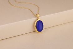 This gorgeous blue cats eye necklace is the perfect gift for any occasion. Choose this beautiful pendant as an anniversary or birthday present for your best friend, sister, mother-in-law, or even yourself. This dainty necklace features  cat's eye beads with a simple silver, 10K, and 14K solid gold chain. Combine the necklace with other gemstones to create a personalized look! Details of the product Material: 10K and 14K Solid Gold, Silver Gemstone: Blue Cat Eye Gemstone Gemstone Size: 12x16 mm Unique Gift For people whom you love; Mom, Girlfriend, Wife, Fiance, Best Friend; Dainty Gift Idea; Valentine's Day Gift, Birthday Gift, Anniversary Gift, Gift For Engagement or Wedding, Promise Gift, Christmas Gift, Black Friday Gift, Mother's Day Gift, International Women's Day Gift, Memorial Gift. Elegant Blue Necklace For Birthday Gift, Blue Pendant Necklace For Birthday Gift, Elegant Blue Jewelry For Birthday Gift, Blue Round Necklace For Birthday Gift, Blue Gemstone Necklace For Birthday Gift, Blue Gemstone Jewelry For Birthday Gift, Blue Oval Pendant Necklace For Anniversary, Blue Oval Locket Necklace, Oval Blue Locket Necklace