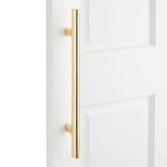 a white door with a gold handle on it